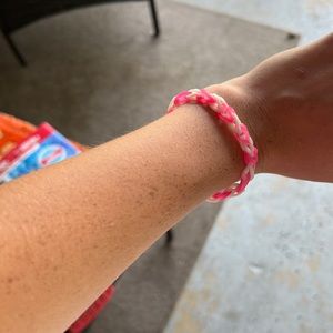 It’s pink and white bracelet